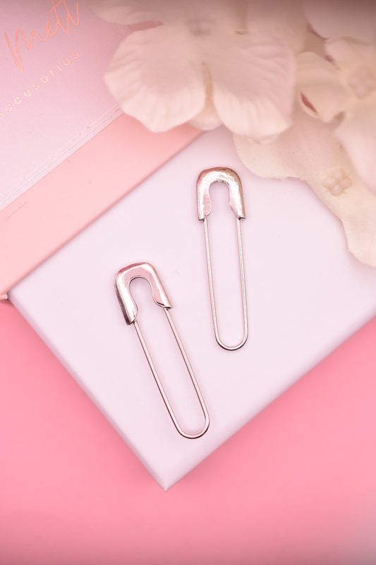 Aretes en forma de seguros